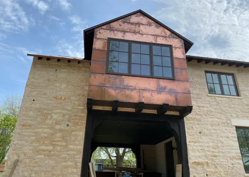 Copper metal panel facade on a stone building for Skylight Installation in Walkersville